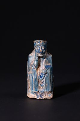 A Glazed Ceramic Figural Chess King, 19th Century. A ceramic chess king modelled as a seated 