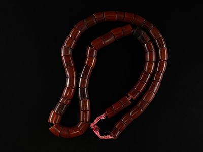 A Strand of Berber Bakelite Beads. A substantial strand composed of large cylindrical bakelite 