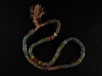 An African Polychrome Millefiori Trade Bead Necklace. A vibrant strand composed of elongated 