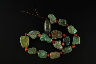A Strand of African Turquoise and Coral Beads. A distinctive strand of African beads composed 
