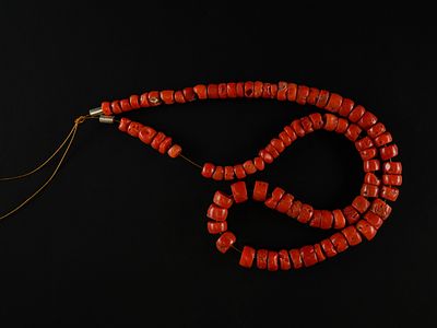 A Strand of African Coral Trade Beads. A striking strand of African coral trade beads composed 