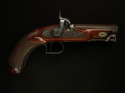 A Percussion Cap Travelling Pistol with Octagonal Barrel and Chequered Grip, 19th Century. A 