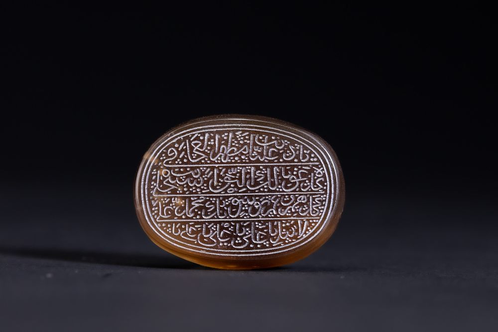 Lot 151: An Islamic Agate Seal Stone with Multi-Line Arabic...