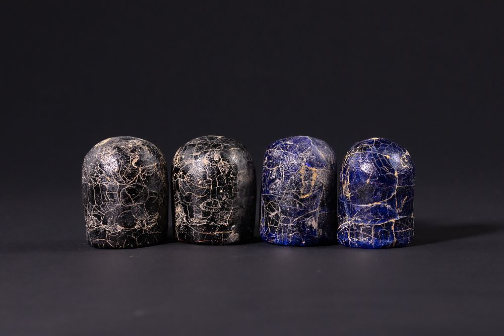 Lot 162: A Group of Four Islamic Glass Gaming Pieces,...