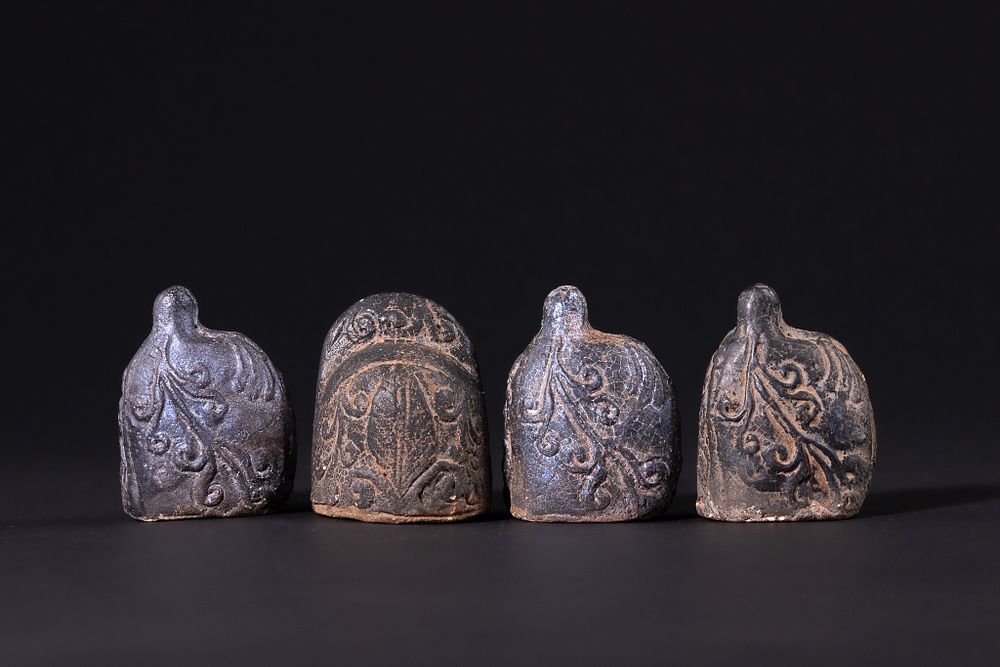 Lot 167: An Islamic Ceramic Chess King and Three Pawns,...
