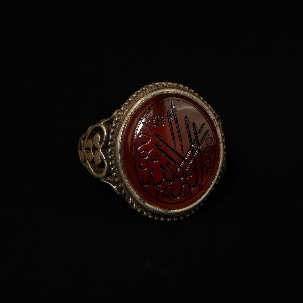 Lot 203: An Islamic Silver Ring with Carnelian Agate Intaglio.