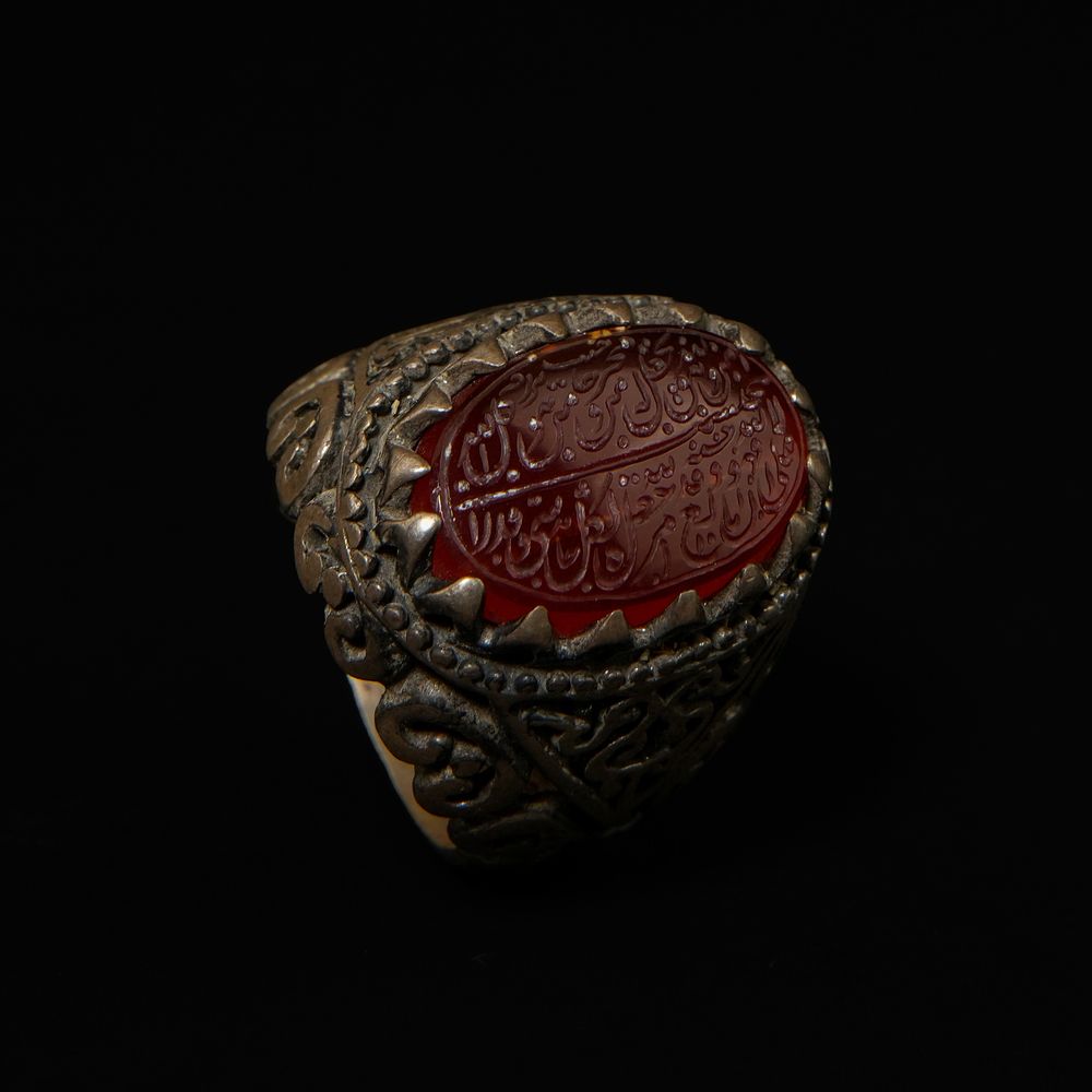 Lot 208: An Islamic Silver Ring Set with an Oval...