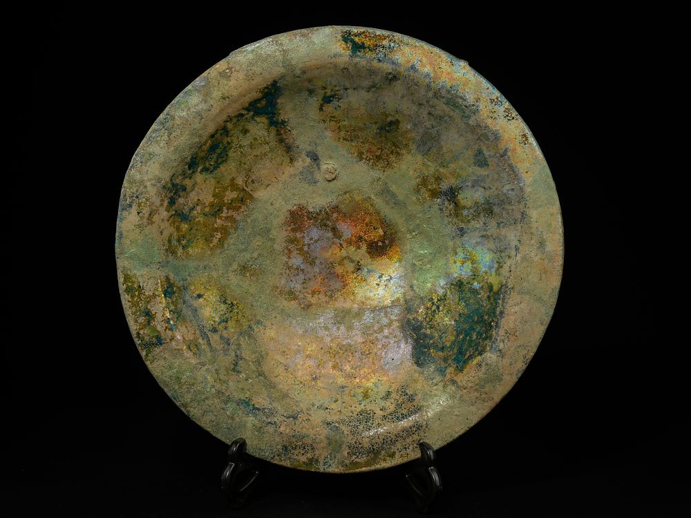Lot 212: A Large Islamic Iridescent Glass Bowl with Weathered...