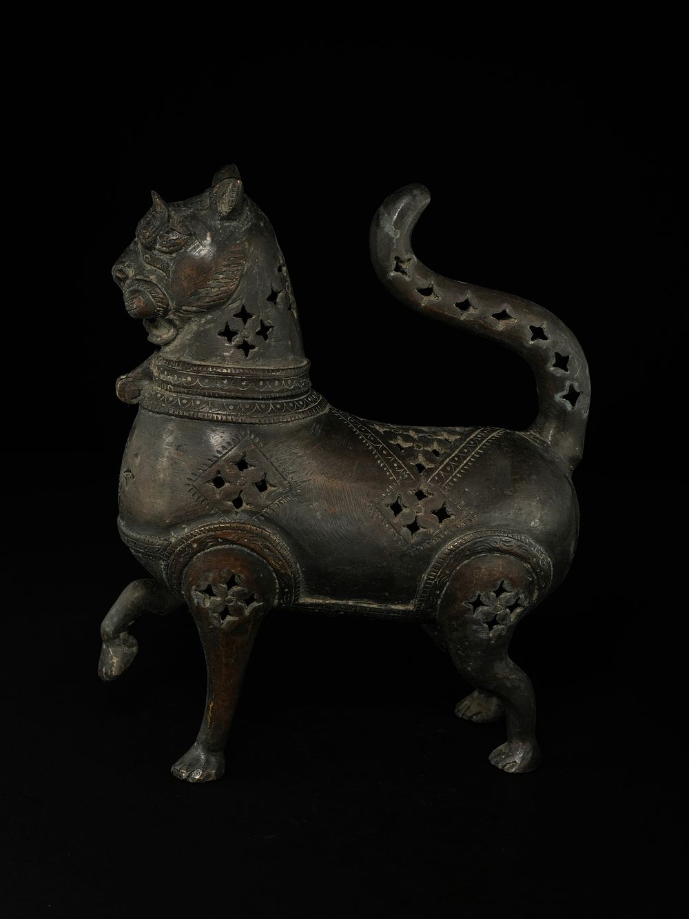 Lot 213: A Khorassan Style Pierced Bronze Feline-Form Incense Burner.