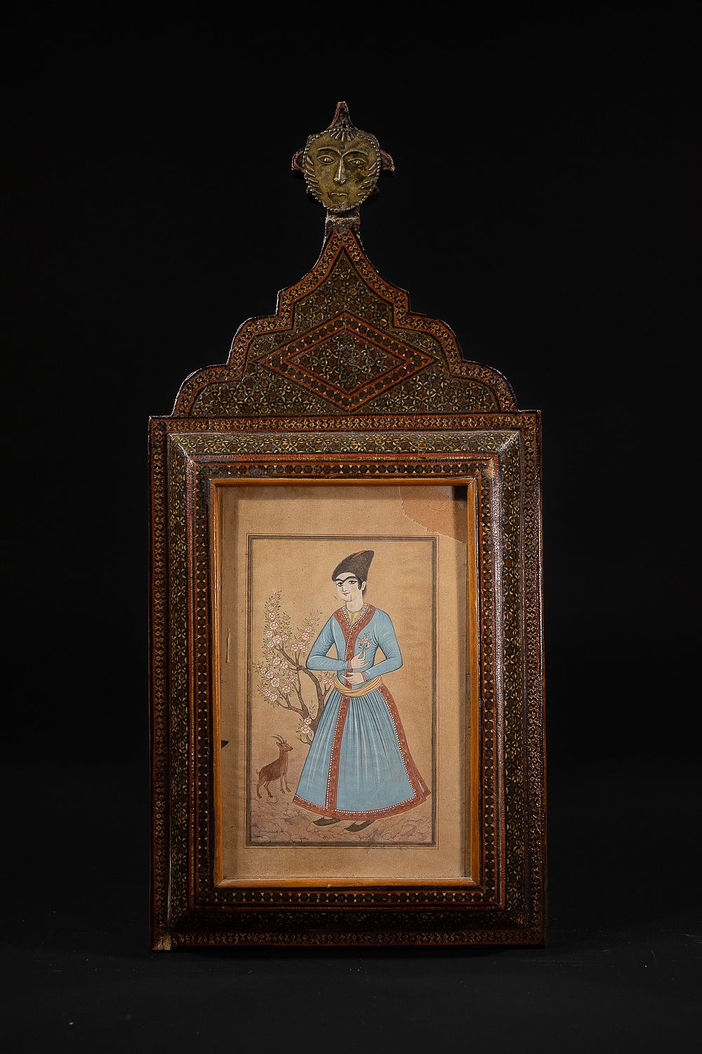 Lot 260: A Qajar Miniature Painting of a Standing Figure...
