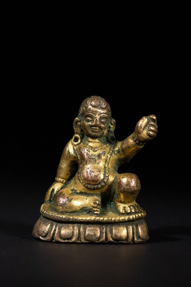 Lot 265: A Tibetan Gold Gilt Bronze Figure of Jambhala,...