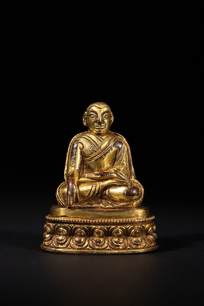 Lot 266: A Tibetan Gold Gilt Bronze Figure of a...