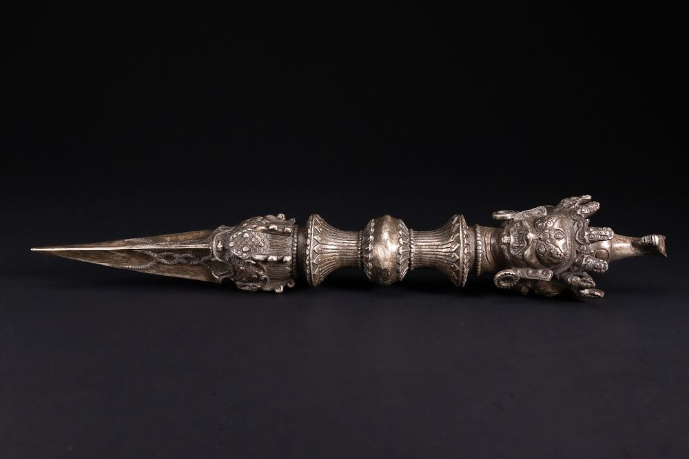 Lot 271: A Large Tibetan White Metal Phurba Ritual Dagger...