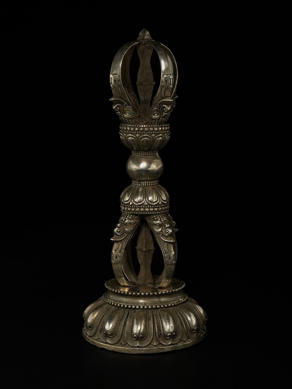 Lot 274: A Tibetan White Metal Vajra (Dorje) on Lotus...