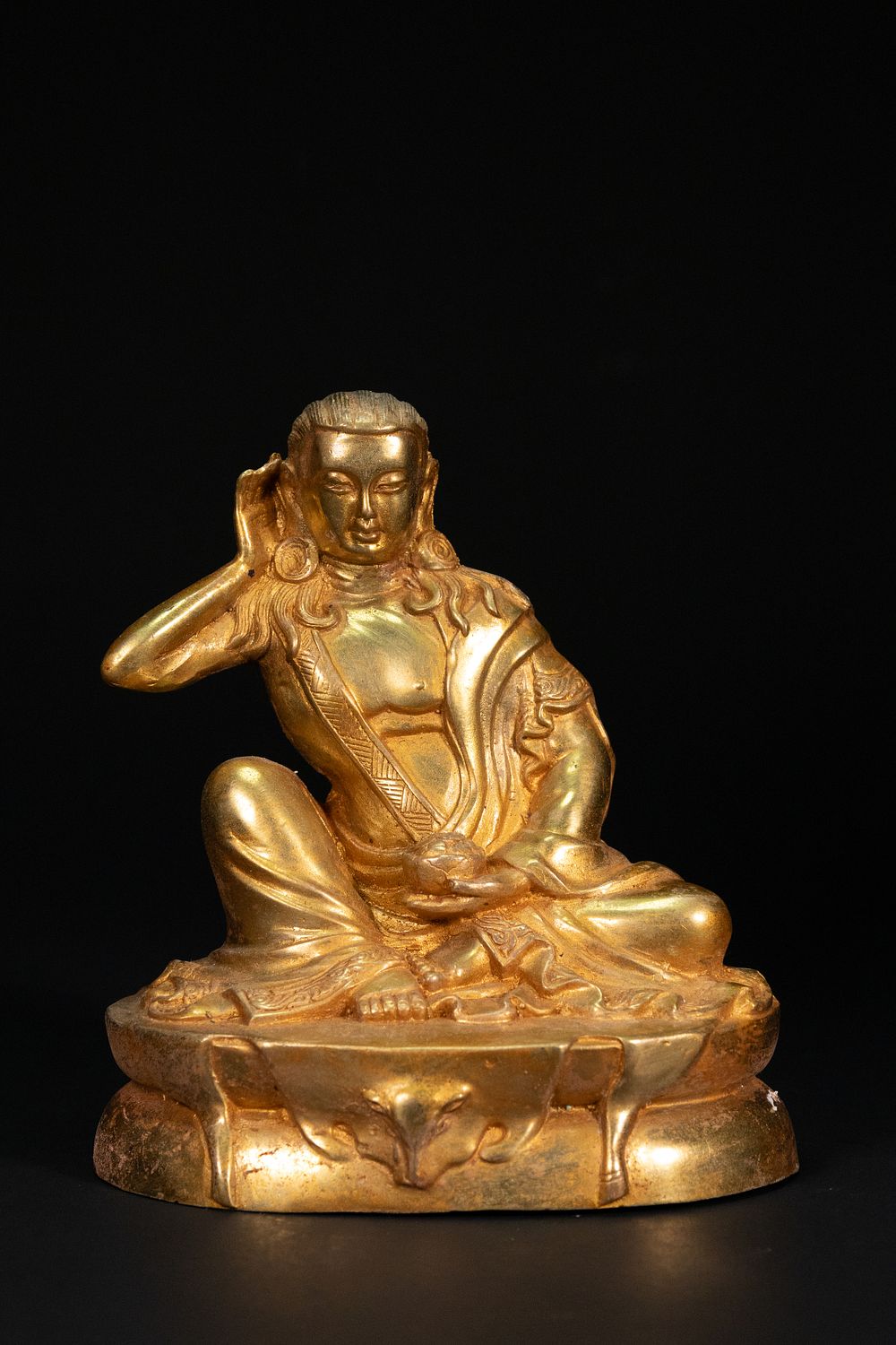 Lot 284: A Tibetan Gilt-Bronze Figure of Milarepa.