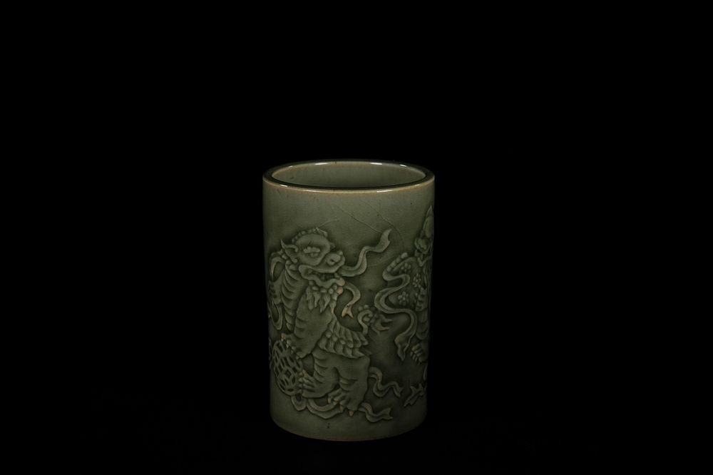 Lot 288: A Chinese Celadon Dragon Brush Pot, Qianlong Mark....