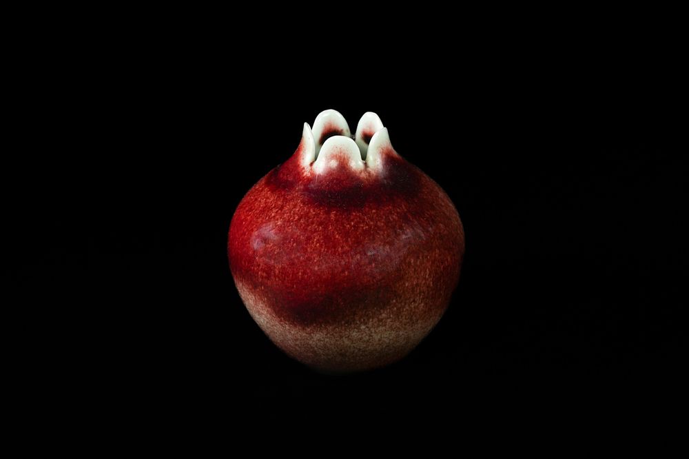 Lot 298: A Chinese Pomegranate-Form Flambé-Glazed Ceramic Vase, Qianlong Mark....