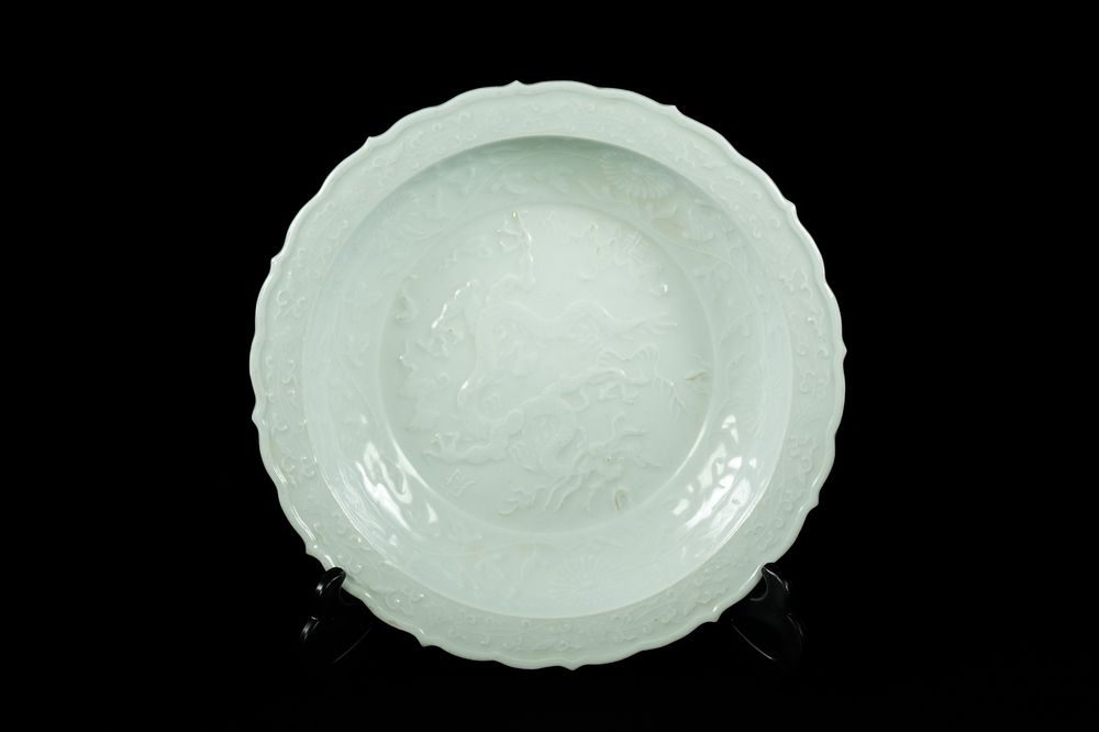 Lot 307: A Chinese Celadon-Glazed Porcelain Dish with Dragon Decoration...