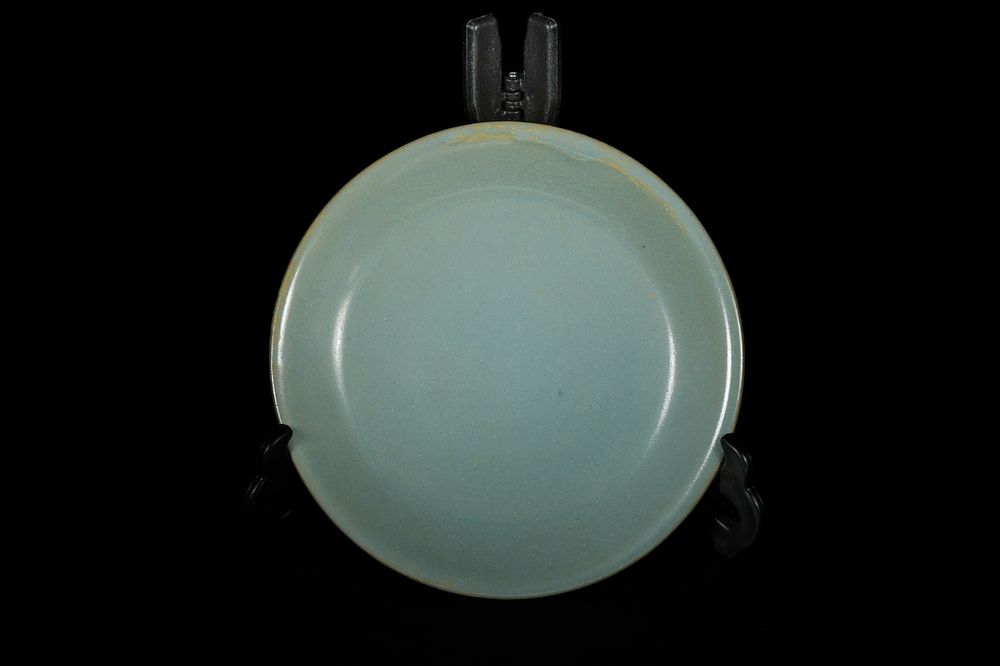 Lot 320: A Chinese Ru Kiln Celadon Glazed Dish. -