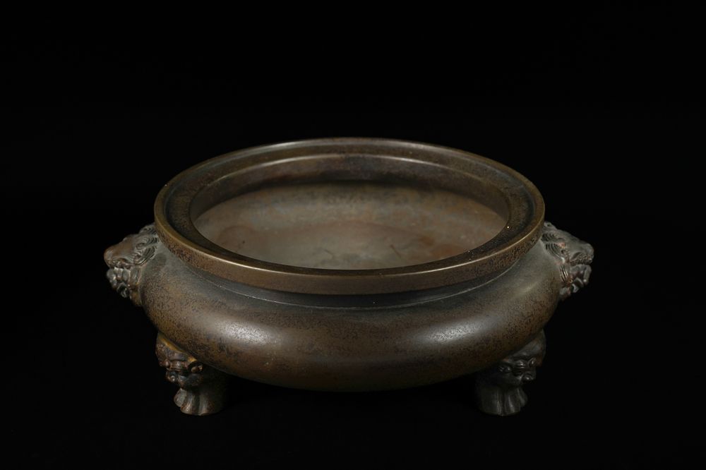 Lot 331: A Chinese Bronze Tripod Censer, Xuande Mark. -