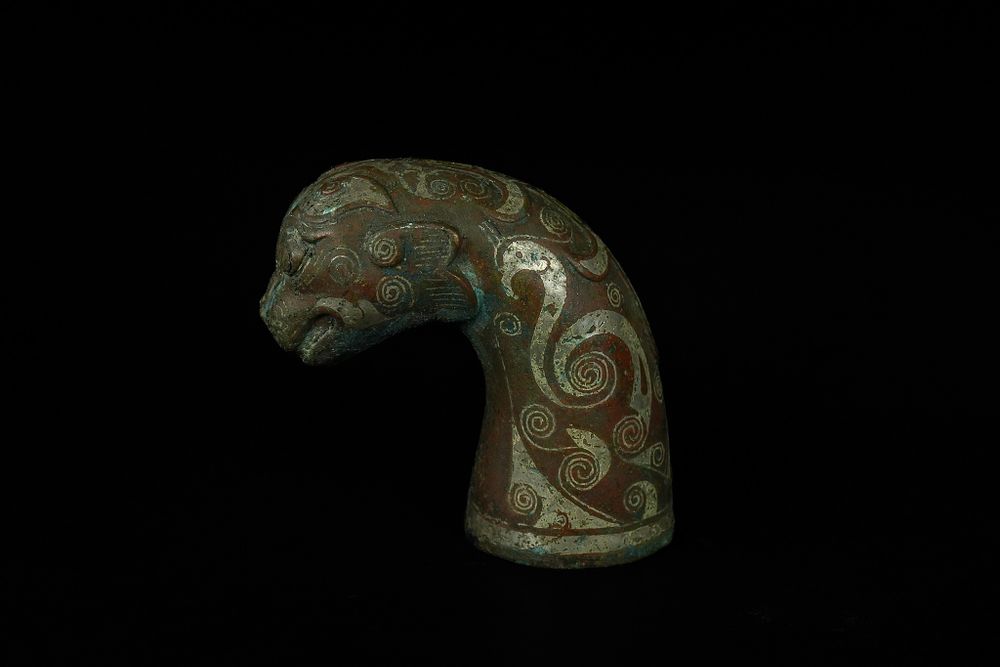 Lot 345: A Chinese Gold and Silver-Inlaid Bronze Mythical Beast...