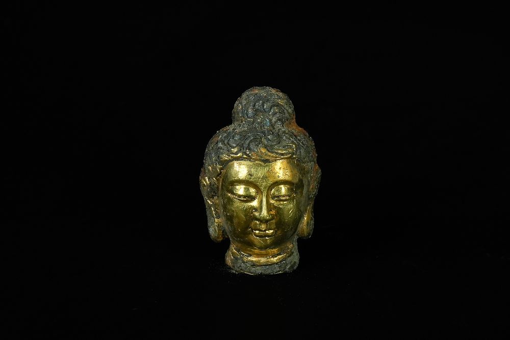 Lot 346: A Chinese Tibetan Gilded Bronze Buddha Head, 19th...