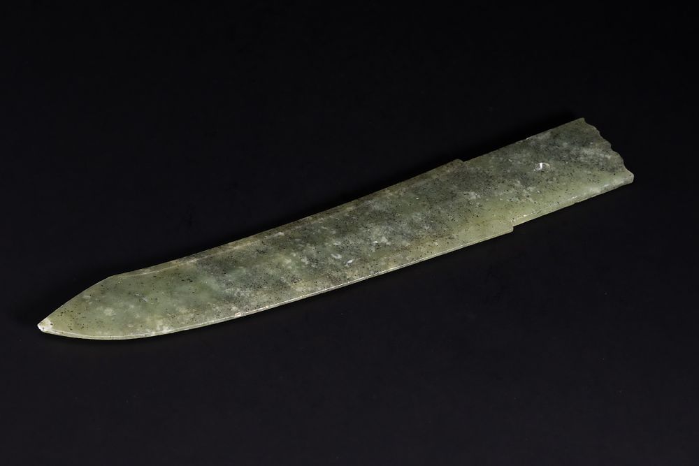 Lot 362: A Chinese Celadon Jade Dagger-Form Blade.