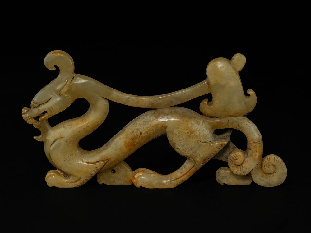 Lot 377: A Chinese Jade Carved Dragon-Form Fitting.