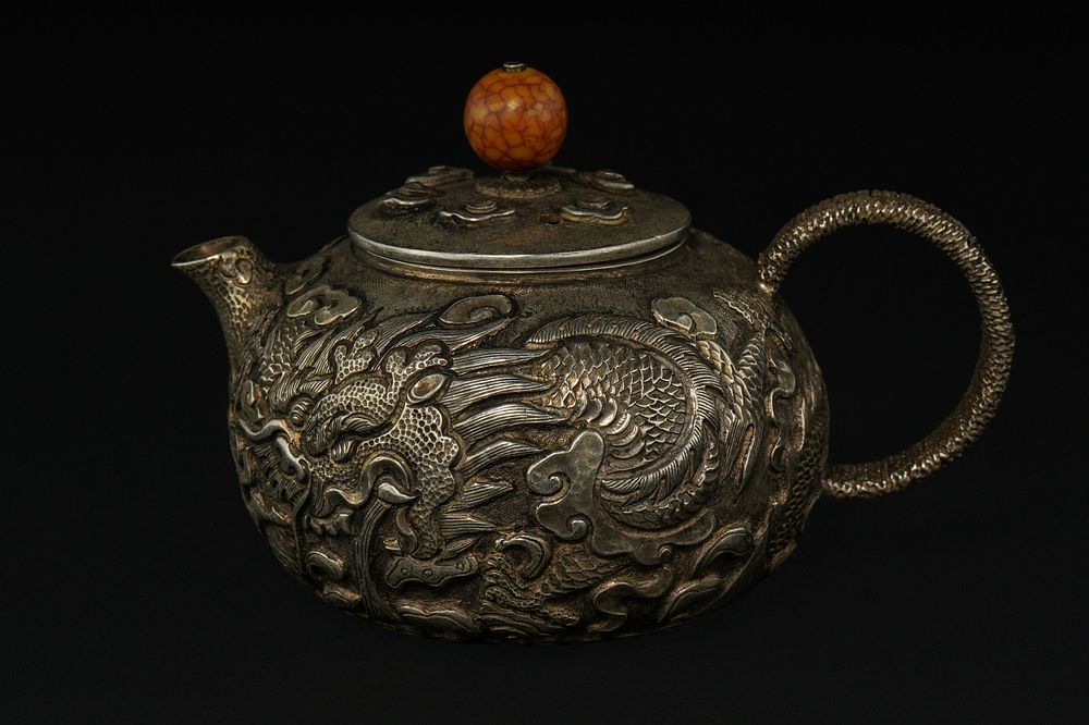 Lot 383: A Chinese Metal Teapot with High-Relief Dragon Decoration...