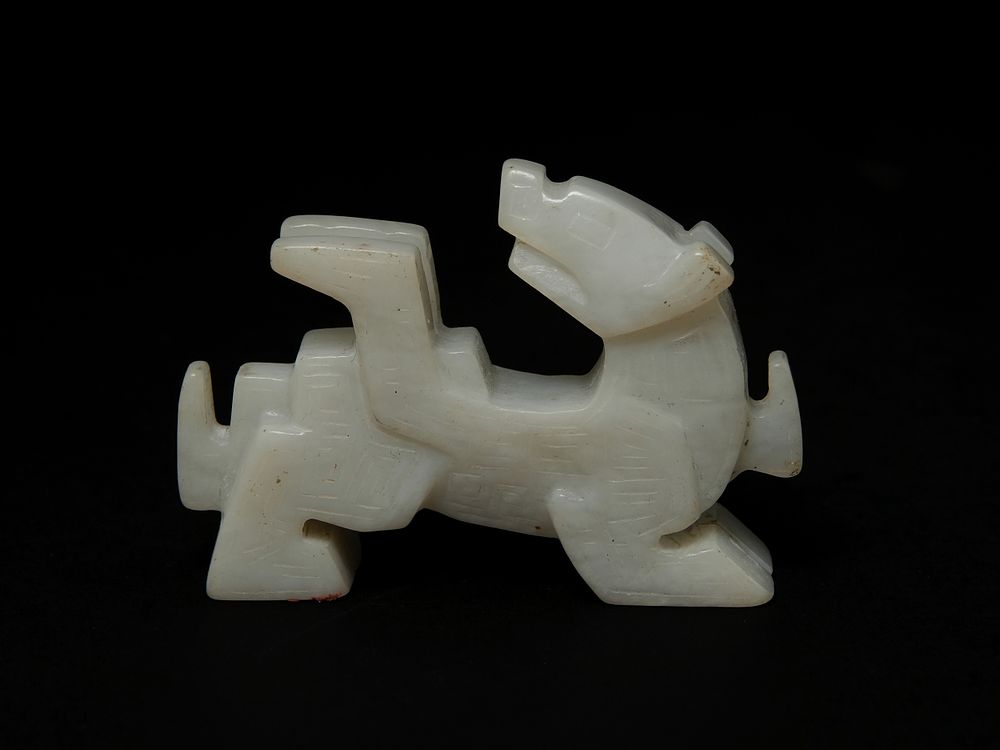 Lot 403: A Chinese Jade Abstract Zoomorphic Figure.