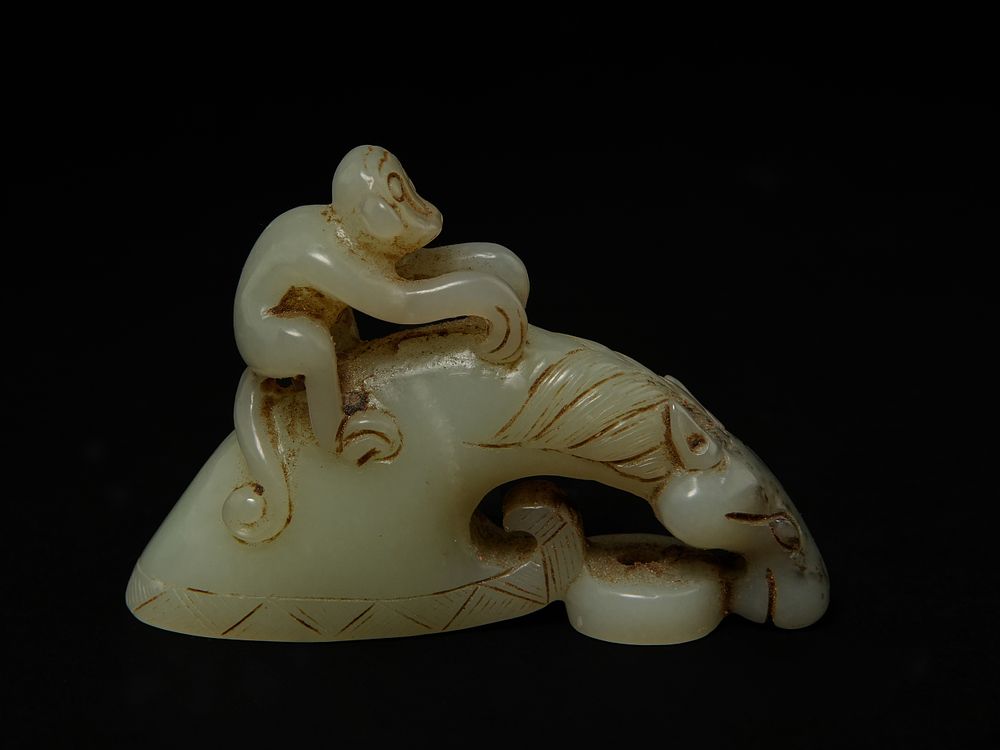Lot 405: A Chinese Jade Carving of a Recumbent Mythical...