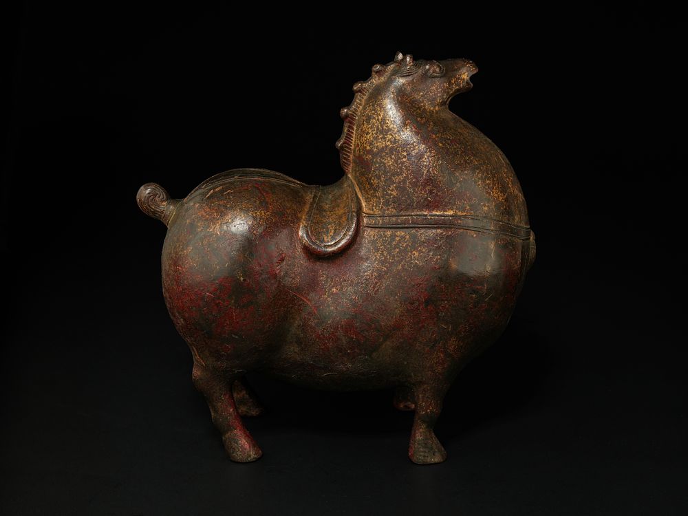 Lot 411: A Chinese Bronze Figure of a Standing Horse.