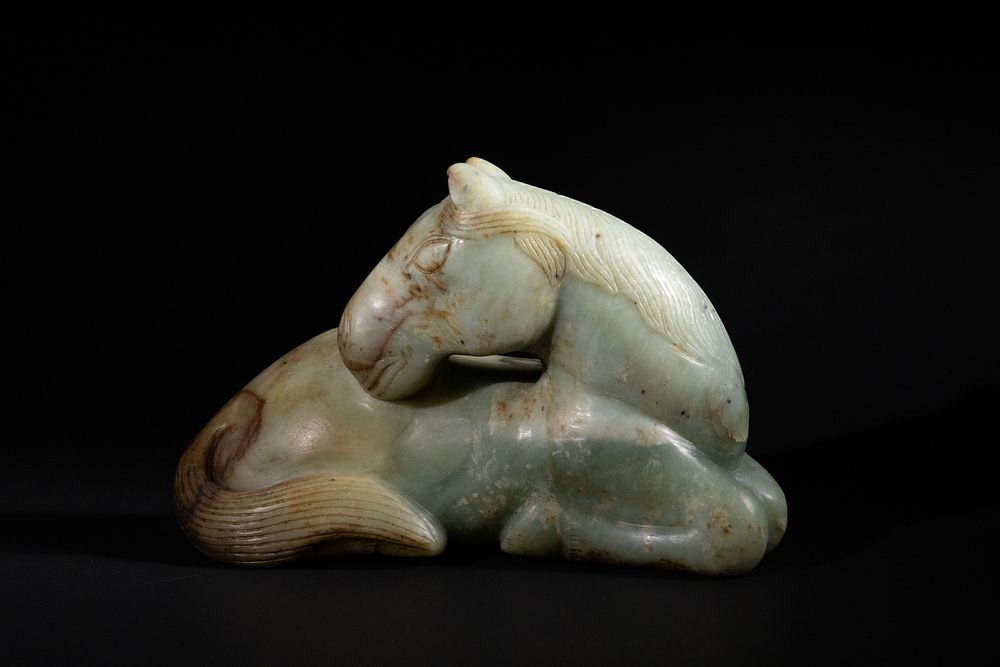 Lot 413: A Large Chinese Jade Figure of a Recumbent...