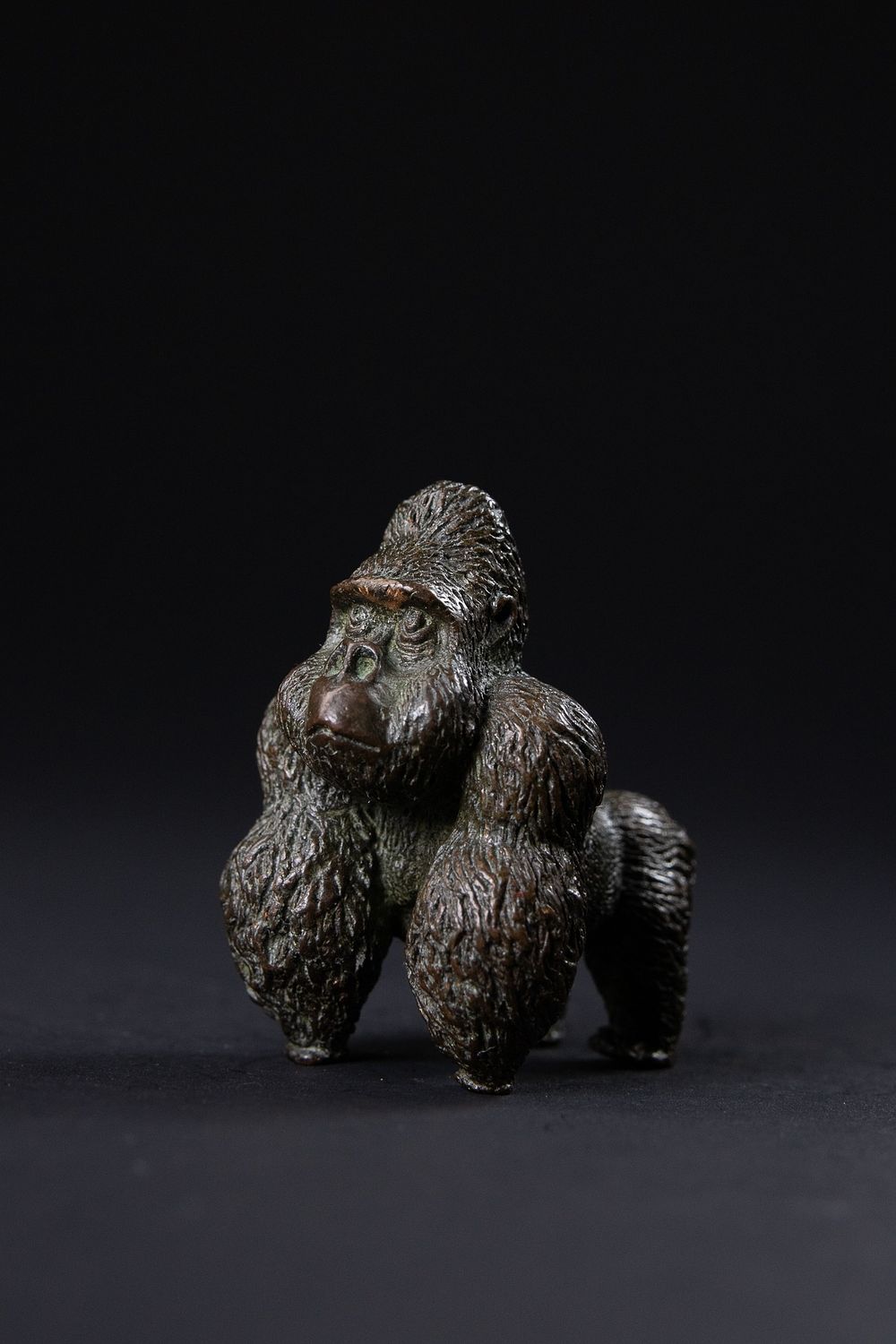Lot 416: A Japanese Bronze Okimono Figure of a Gorilla....