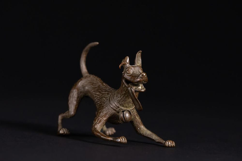 Lot 428: A Japanese Bronze Model of a Playful Dog...