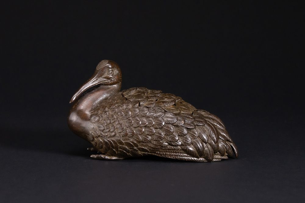 Lot 432: A Japanese Bronze Model of a Recumbent Waterfowl.