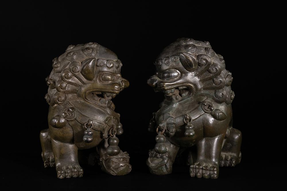 Lot 191: A Pair of Chinese Bronze Foo Dog Guardian...