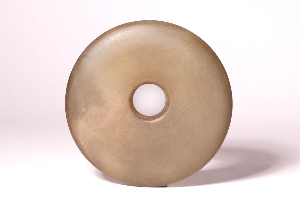 Lot 197: A Chinese Carved Hardstone Bi Disc.