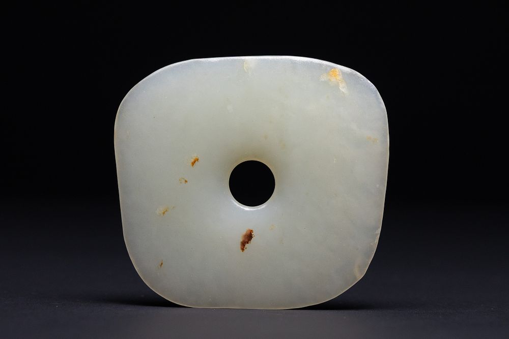 Lot 201: A Chinese White Jade Bi Disc.