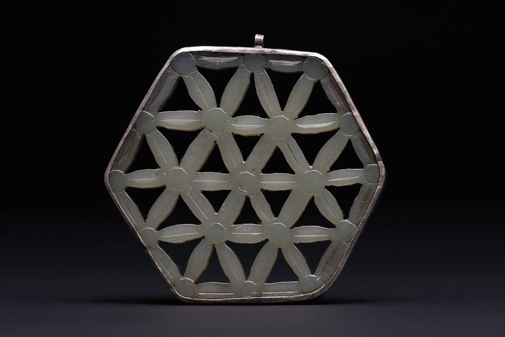 Lot 202: A Chinese Jade Openwork Pendant Mounted in a...