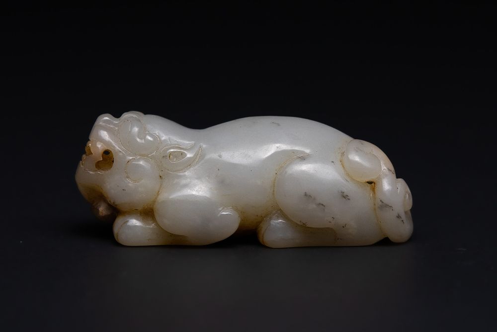 Lot 209: A Chinese Jade Carving of a Recumbent Mythical...