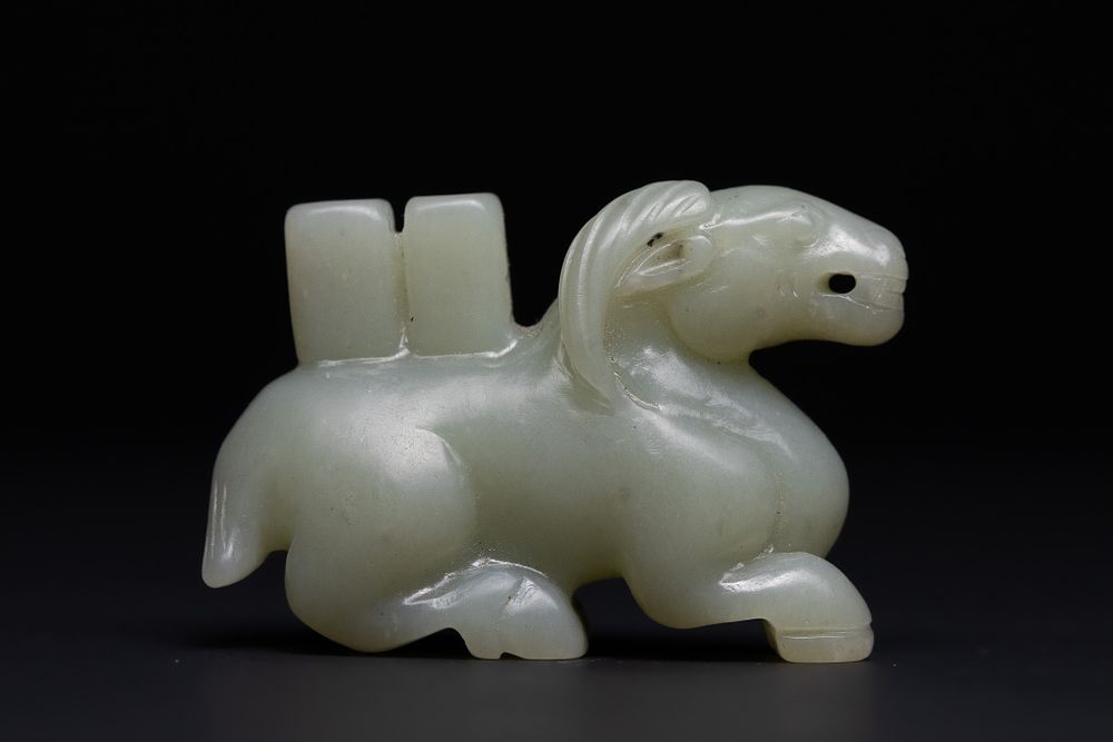 Lot 210: A Chinese Jade Carving of a Recumbent Horse-Form...