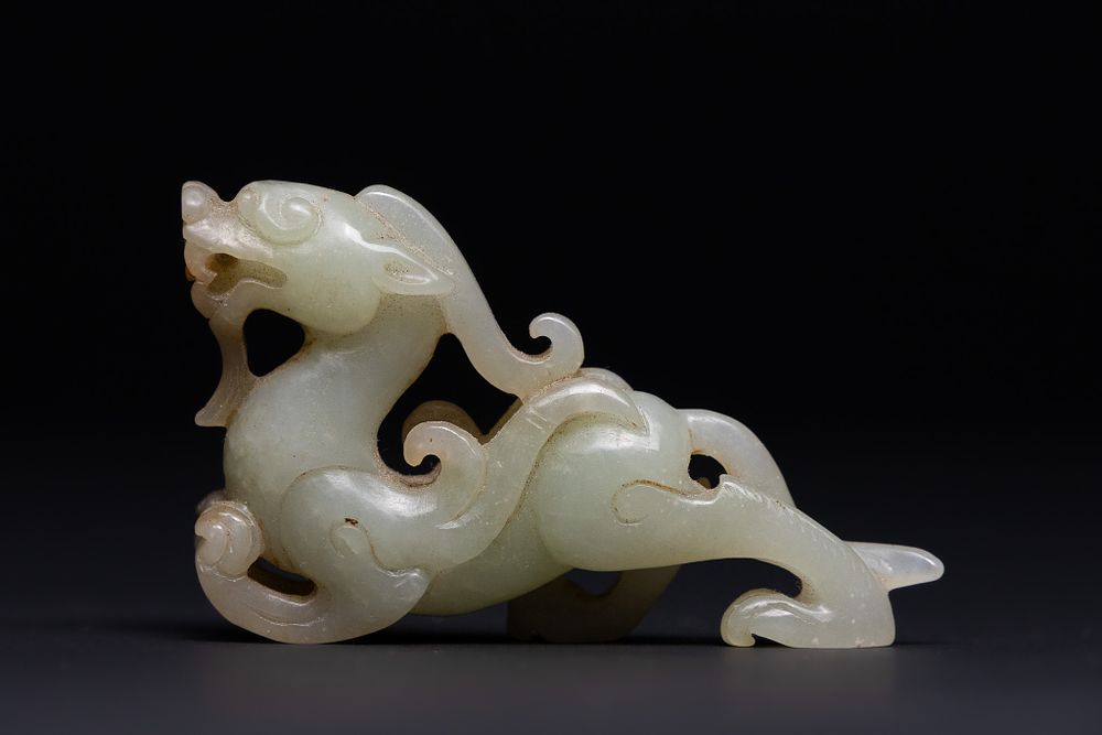 Lot 213: A Chinese Jade Carving of a Mythical Beast.