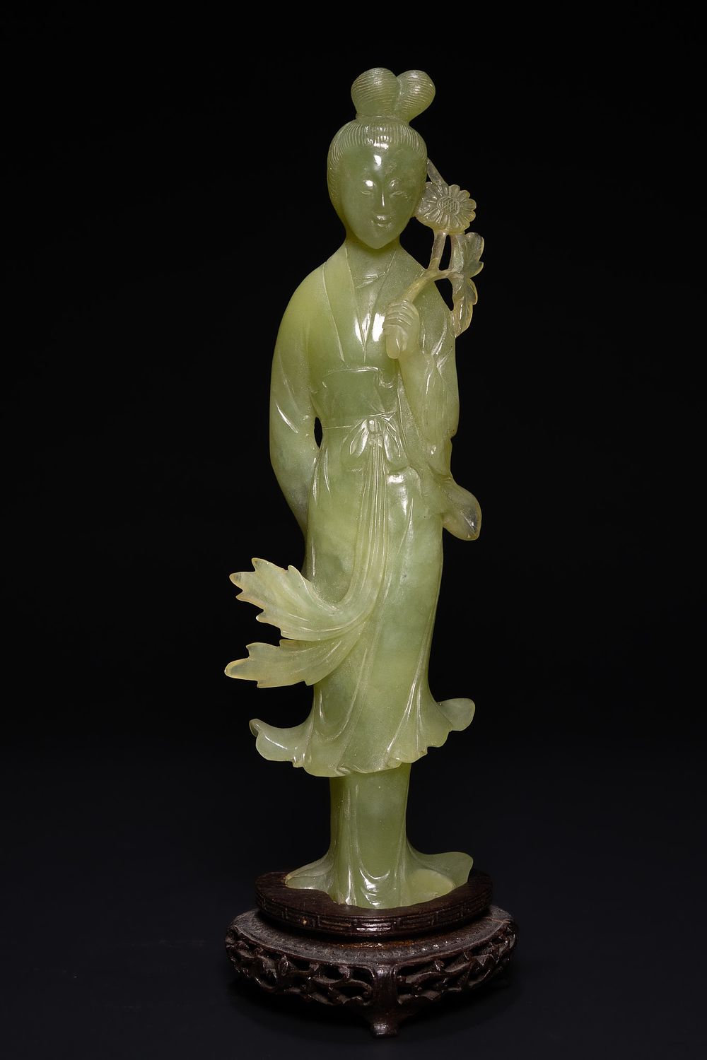 Lot 218: A Chinese Jade Figure Of A Lady Holding...