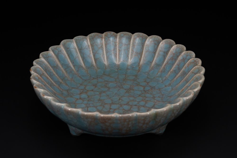 Lot 220: A Chinese Crackle-Glazed Celadon ‘Lotus’ Bowl.