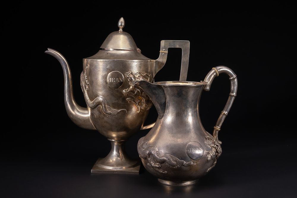 Lot 221: A Chinese Export Silver Tea and Water Set...