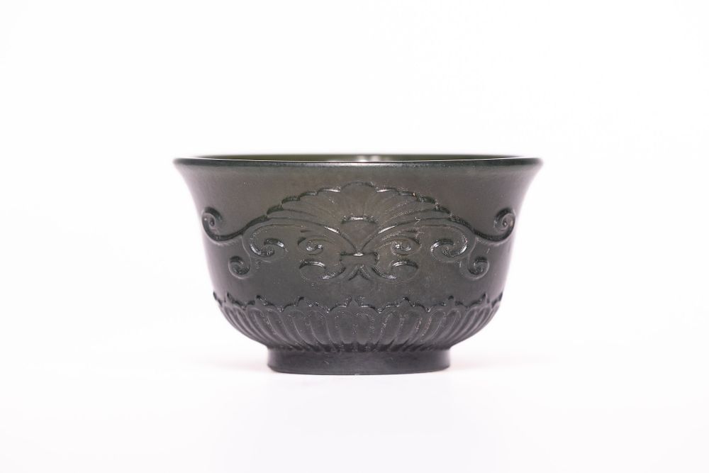 Lot 222: A Chinese Carved Spinach Green Jade Bowl, Possibly...