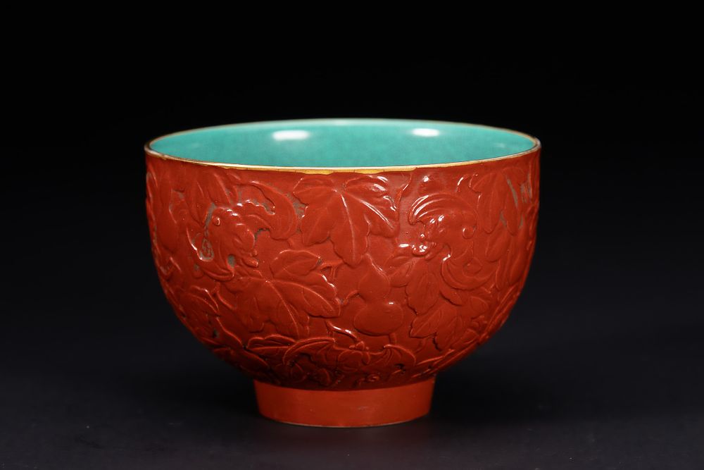 Lot 244: A Chinese Red-Ground Relief-Decorated Bowl with Turquoise Interior,...