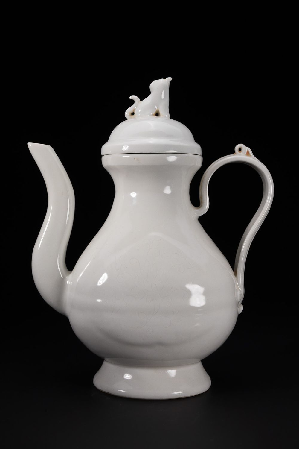 Lot 250: A Chinese Blanc-de-Chine Porcelain Ewer with Cover.