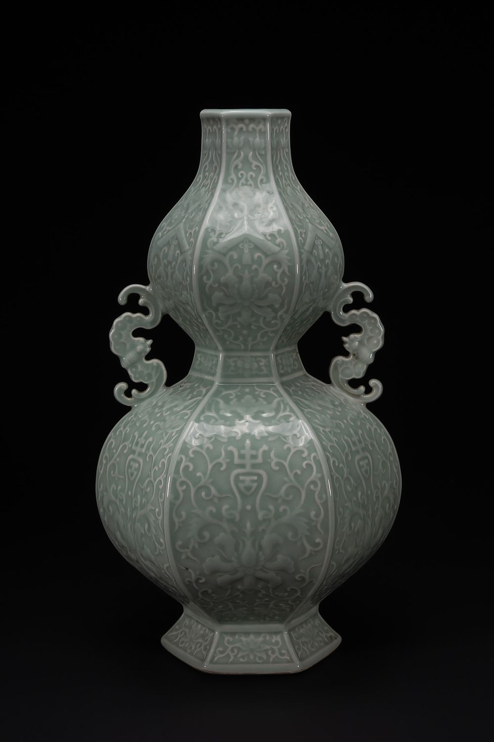 Lot 277: A Chinese Celadon-Glazed Double-Gourd Vase with Relief Decoration...